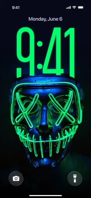 Lock screen preview with a neon mask wallpaper behind the clock